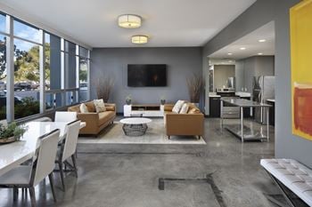 Modern Social Room with a Kitchen and Theater Television